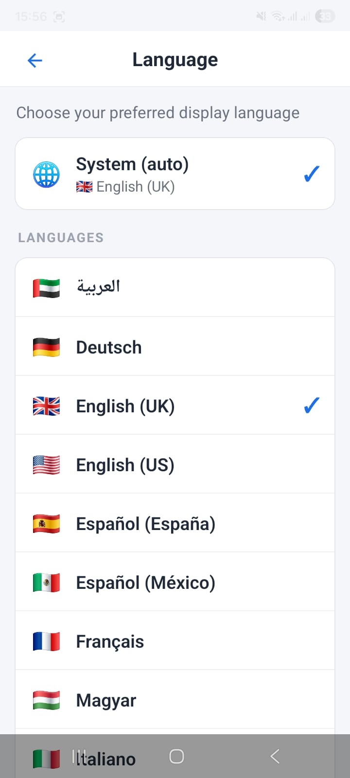 OpenCRMApp Language settings screen showing System (auto) English UK selected with blue checkmark at top, then LANGUAGES list with flags: Arabic (UAE), Deutsch (Germany), English UK (checkmark), English US, Español España, Español México, Français, Magyar, Italiano partially visible