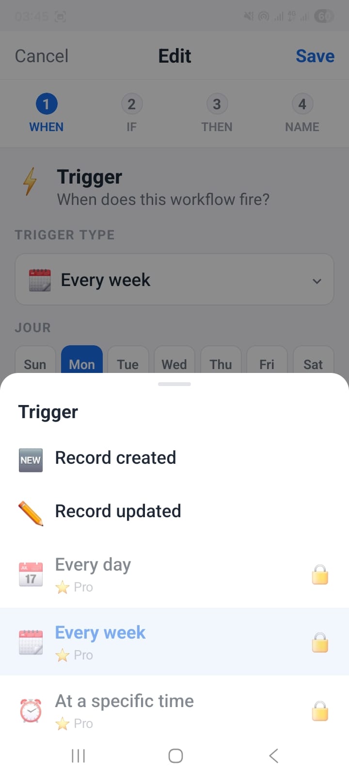 OpenCRMApp Workflow Builder Step 1 WHEN screen showing trigger options: Record created, Record updated, Every day (Pro), Every week (Pro, selected), and At a specific time (Pro)